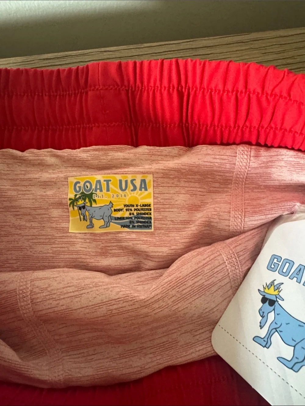 GOAT USA youth XL Boys' Blue Swim Trunks with Red Waistband